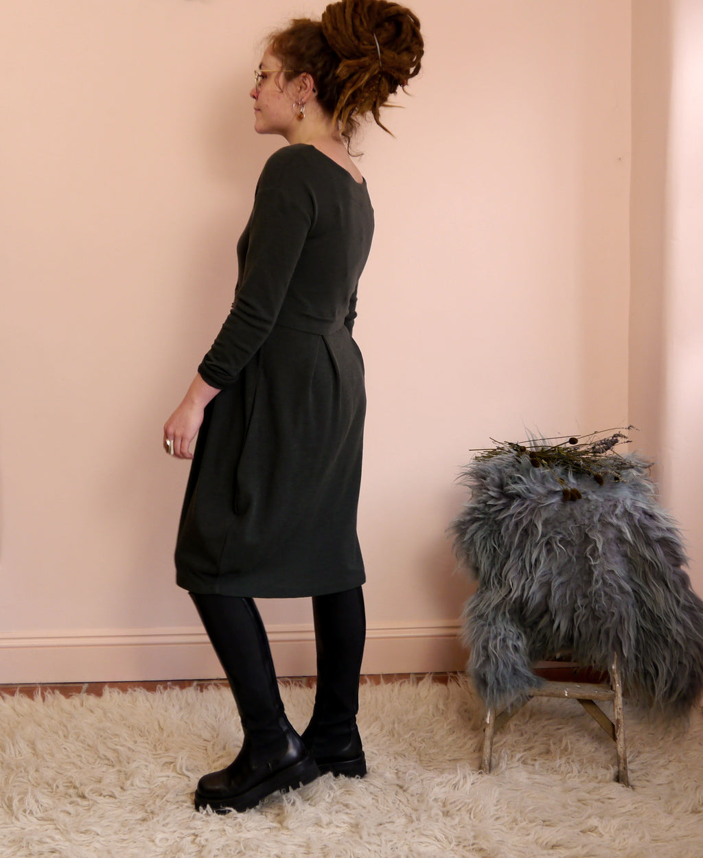 Merino Wool Round Neck Empire Waist Pleat Dress in Raven